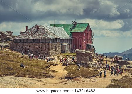 Bucegi Mountains Romania - August 6 2016: Thousands of tourists hike the trails to the Babele (The Old Women) chalet at 2206 m altitude in Bucegi Mountains to visit the Babele Rocks and the Sphinx.