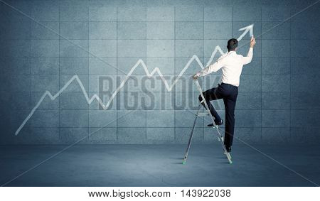 A man standing on a ladder and drawing a chart on blue wall background with exponential progressing curve, line