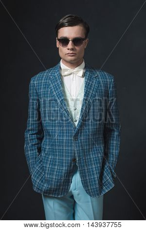 Sharp Dressed Young Man In Retro 1920S Style. Wearing Sunglasses.
