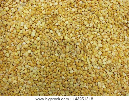 Dry peas. Background of halves dry peas. Scattered peas. Peas as background.