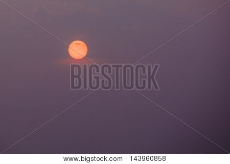 Close View Of Orange Disk Of Setting Rising Sun, Violet Cloudless Sky Background, Sunrise, Sunset, Dawn.