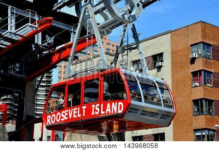 New York City - August 31 2011: Roosevelt Island tram filled with passengers departing the Second Avenue and East 59th Street station following its crossing of the East River to Manhattan