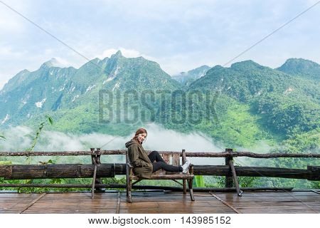 Smiling Young Woman With  Montains Background ( Chiang Mai Province, Thailand )