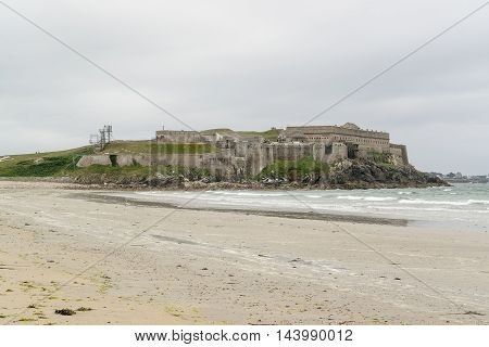 coastal scenery including a fortification near a commune named Quiberon in the Morbihan department in Brittany France
