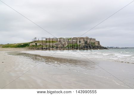 coastal scenery including a fortification near a commune named Quiberon in the Morbihan department in Brittany France