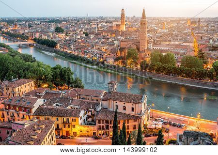 Verona panoramic aerial view on illuminated old town on the sunset in Italy