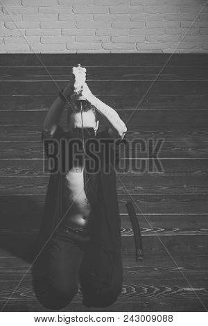 Serious Man. Man With Sword And Open Belly Preparing For Harakiri. Samurai Warrior With Katana Sitti