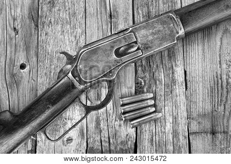 Antique 1876 Lever Action Cowboy Rifle In Black And White.