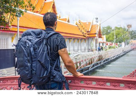 Man Backpacher Visiting Asia During A Sunny Day , Solo Trip , Holiday And Vacations Concept .