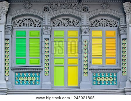 Vintage Singapore Peranakan Or Straits Chinese Shop House With Antique Green And Yellow Wooden Shutt