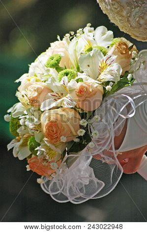 Bouquet Of The Bride At The Wedding Of Light Flowers In The Afternoon