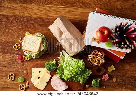 Preparing Ham And Cheese Sandwiches For School Lunchbox On Wooden Background, Close Up. Healthy Eati