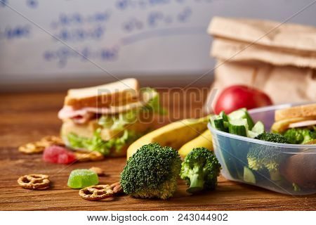 Preparing Ham And Cheese Sandwiches For School Lunchbox On Wooden Background, Close Up. Healthy Eati