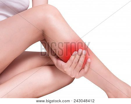 Woman Suffering From Leg Pain, Calf Pain. Red Color Highlight At Calf, Leg Isolated On White Backgro