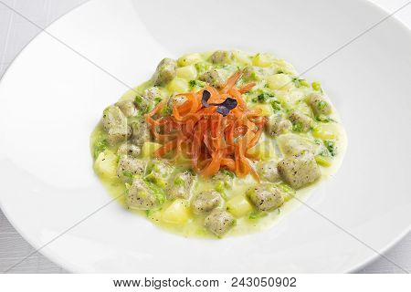 Plate With Buckwheat Dumplings With Cream Of Potato Broccoli And Salmonid Trout