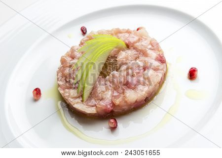 Isolated Fish Plate With Amberjack Tartare With Mustard Jam And Pomegranate Grains