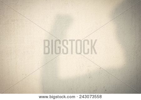 Shadow Of Human Head On Abstract Wall