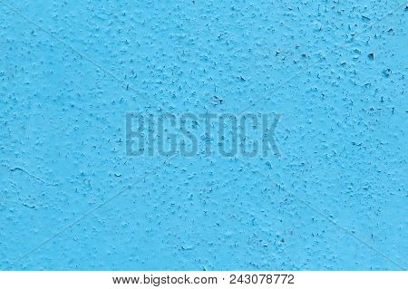 The Surface Of The Wall Is Painted With Blue Oil Paint. The Paint Cracked From Time To Time And From