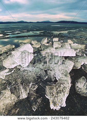 Pieces Of Clear Natural Ice On Frozen Lake,  Very Close Up View. Early Mealting Of Ice, Ecology Prob