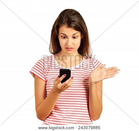 Surprised Student Girl Dressed In A Striped Top, Embarrassed Puzzled Look In Holding A Smartphone In
