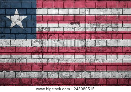 Liberia Flag Is Painted Onto An Old Brick Wall