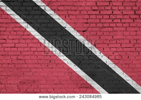 Trinidad And Tobago Flag Is Painted Onto An Old Brick Wall