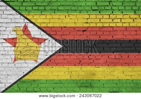 Zimbabwe Flag Is Painted Onto An Old Brick Wall