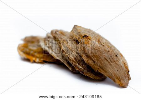 Dried Mango Seeds Or Sukhi Aam Ki Ghuthli Isolated On White.