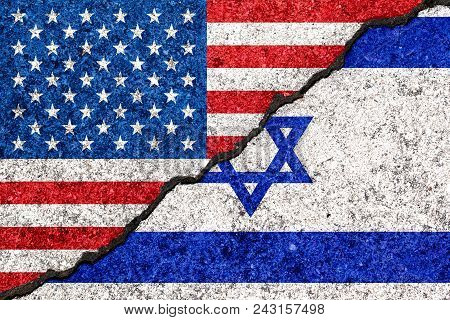Flags Of Israel And Usa Painted On Cracked Wall Background/israel - United States Relations Concept