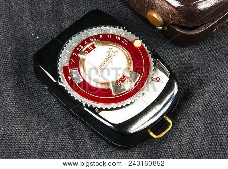 Donetsk, Ukraine - May 07, 2016: Old Vintage Soviet Exposure Meter Leningrad With Leather Case On Bl