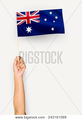 Person waving the flag of Commonwealth of Australia