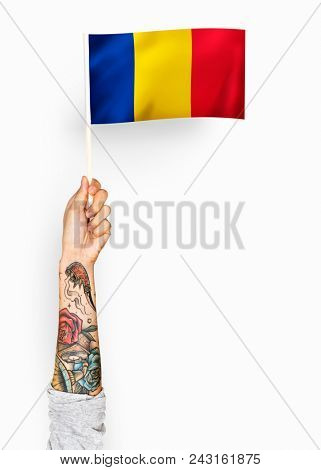 Person waving the flag of Romania