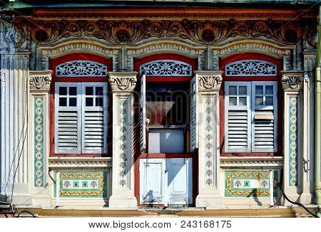 Front View Of Traditional Vintage Singapore Peranakan Or Straits Chinese Shop House With Ornate Exte