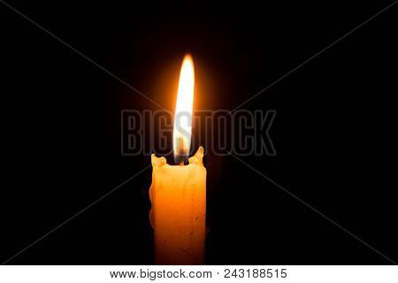 Single lit candle with quite flame