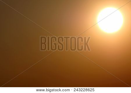 A Solar Disk In The Upper Right Corner Of The Frame At Sunset. Abstract Bright Circle Of Light On A 