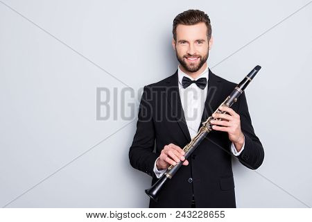 Portrait With Copyspace, Empty Place Of Stylish Cheerful Man With Hairstyle In Black Tux Holding Bas