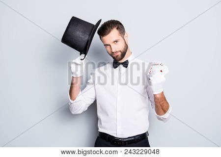 Portrait Of Virile Harsh Illusionist With Stubble And Modern Hairstyle, Holding Tophat And Set Of Ca