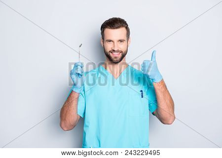 Portrait Of Joyful Cheerful Dental Assistant In Lab Blue Uniform Gesturing Thumbup Approve Advice Ye