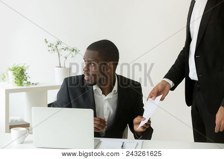 Person Giving Envelope With Bribe To Worried African American Colleague, Partners Being Corrupt In O