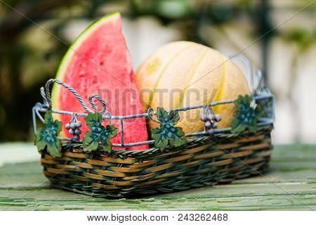 Seasonal Fresh Fruits, Watermelon And Rockmelon In Basket On Table Top, Outdoor