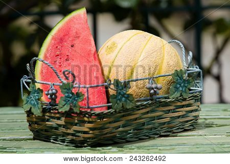Seasonal Fresh Fruits, Watermelon And Rockmelon In Basket On Table Top, Outdoor