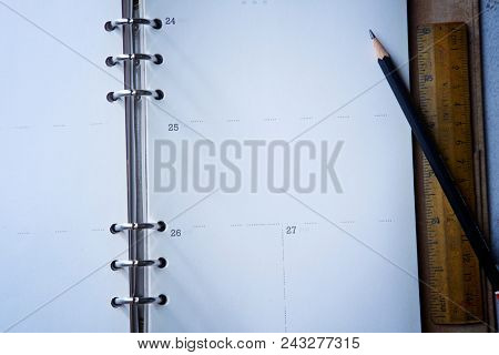 dairy or noote book open page with pencil and ruler