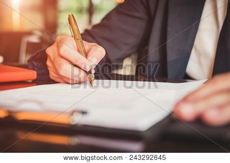 Close Up Asian Business Woman Using A Calculator To Calculate The Numbers.business Finances And Acco