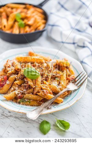 Italian Food And Pasta Pene With Bolognese Sause On Plate