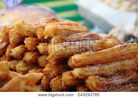 Alfajores Fried Cakes And Churros For Sale At The Street Fair