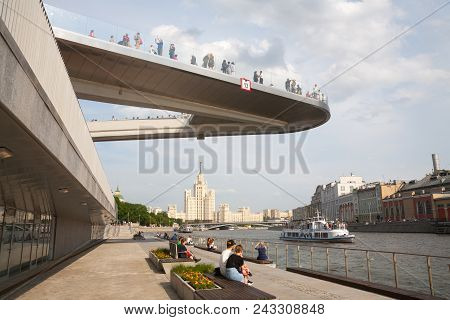Moscow, Russia - May 17, 2018: People Resting On Moskvoretskaya Embankment Under Floating Bridge. Mo