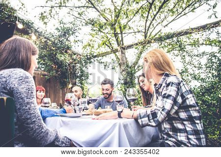 Friends Having Dinner In Garden