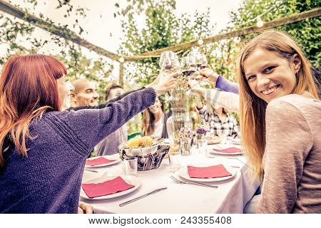 Friends Having Dinner In Garden