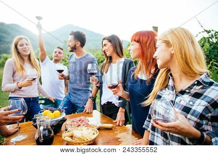 Friends Having Dinner In Garden