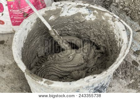 Concrete Mixing With Electrical Drill And Mixer. Wet Facade Insulation.